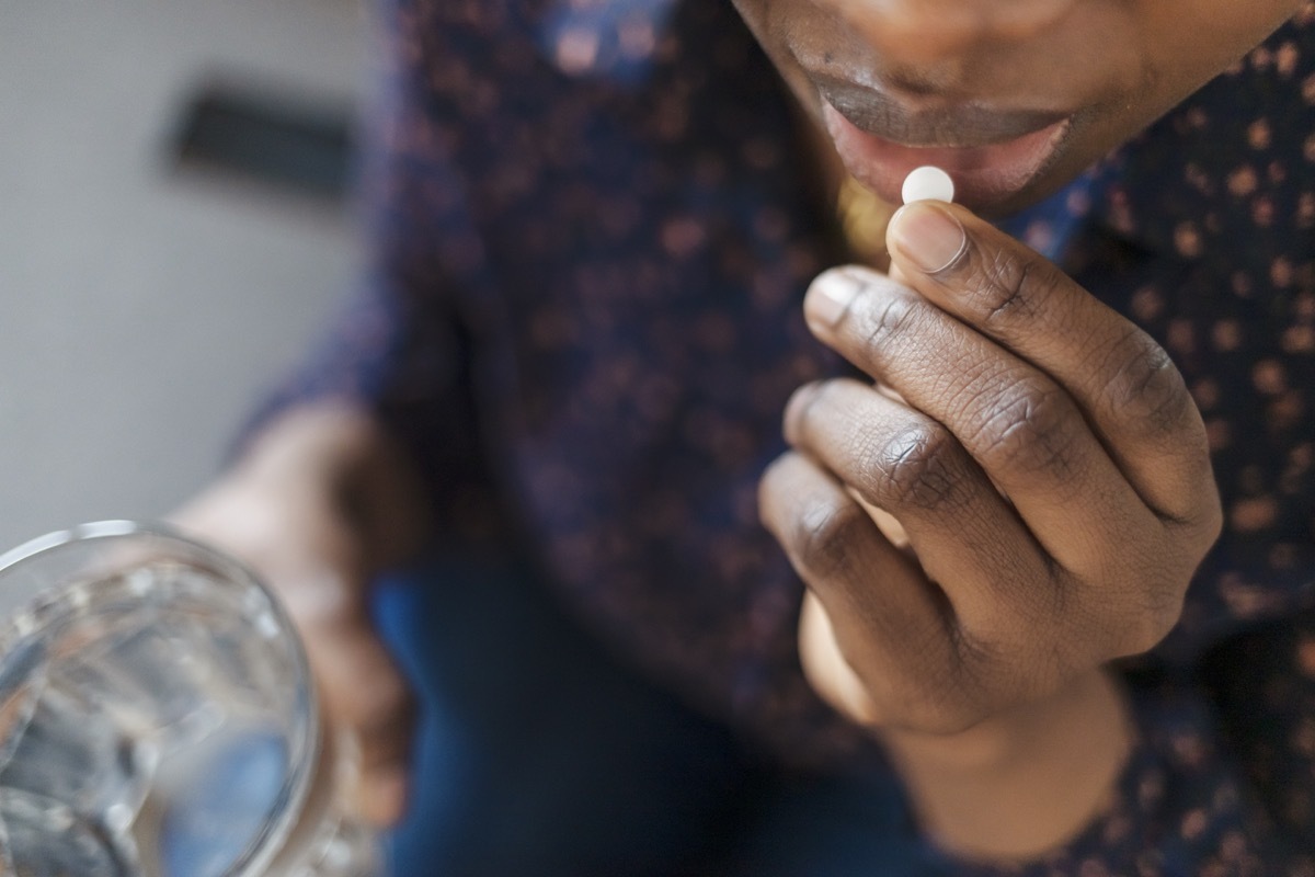 Woman Taking Pill, Supplements or Antibiotic, Female Preparing to Take Emergency Medicine, Chronic Disease, Healthcare and Treatment Concept. Closeup