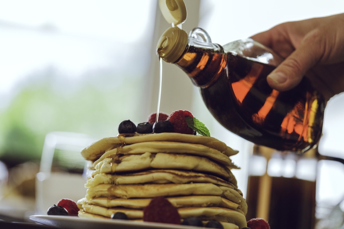 Stack of Pancakes with Maple Syrup and Fresh Berries