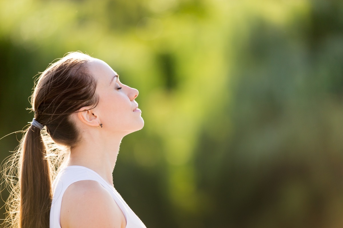 Woman practicing mindfulness outside