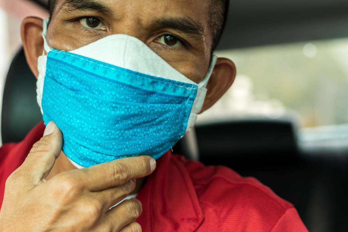 Male wearing two face masks.