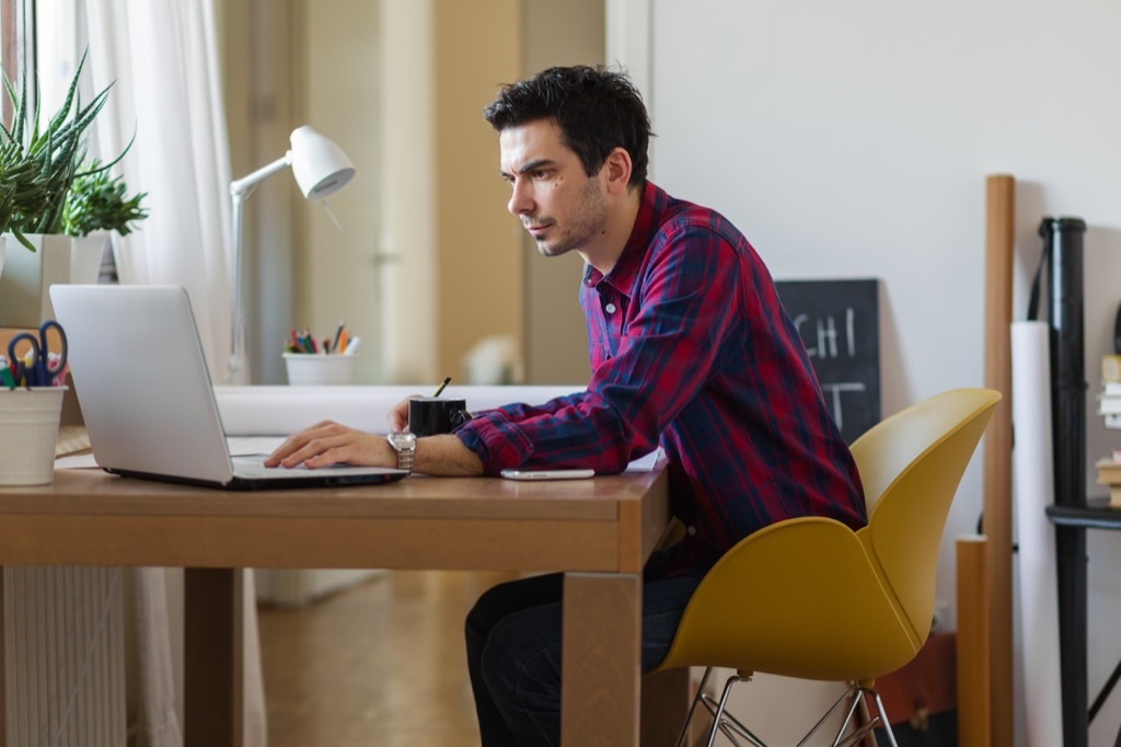 man sitting at a desk and working