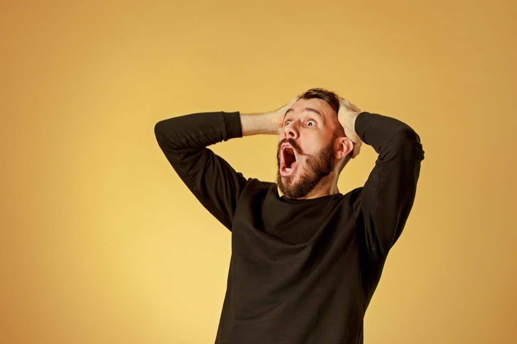 shocked man yellow background