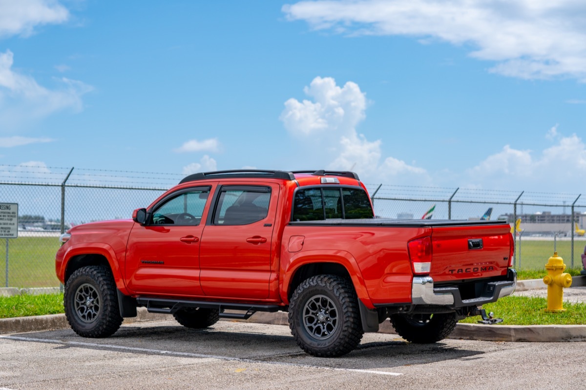 A red Toyota Tacoma pickup