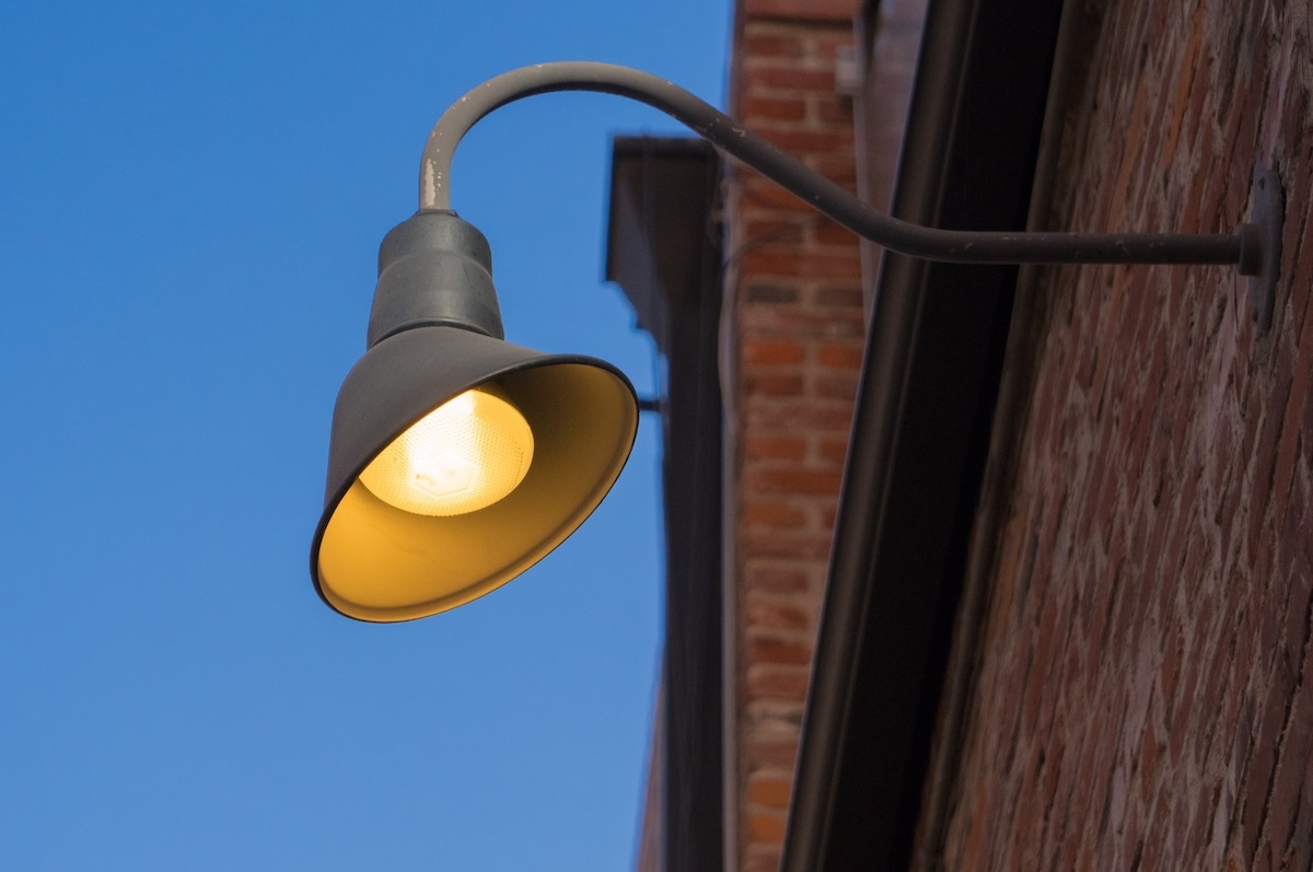 black post lights on a brick building outdoors