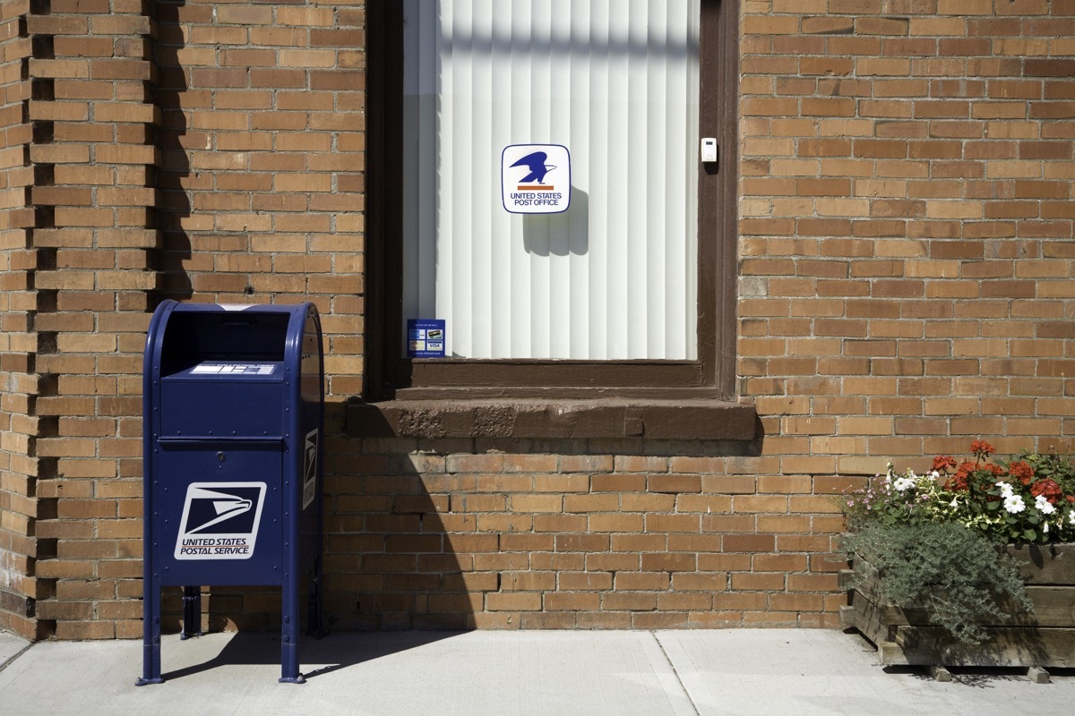 Side view of beautiful Old Brick Post office building in Hartline Washington. Blue US mail box. Small town Hartline has a population of 146. Located between Spokane and Wenatchee.