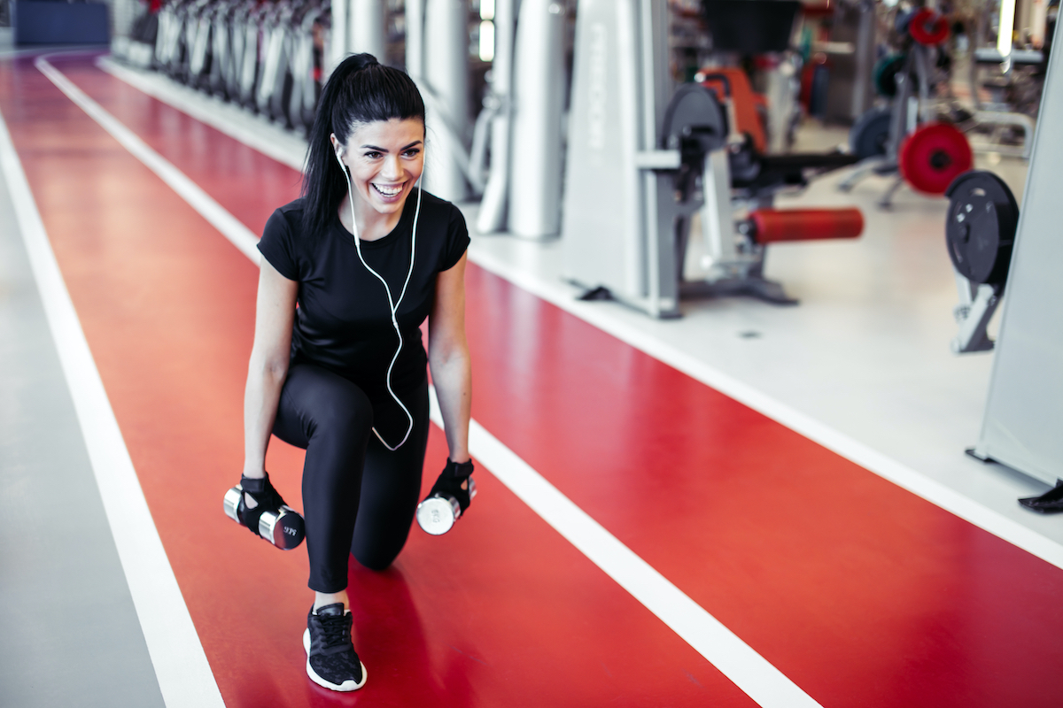 woman at the gym doing squats