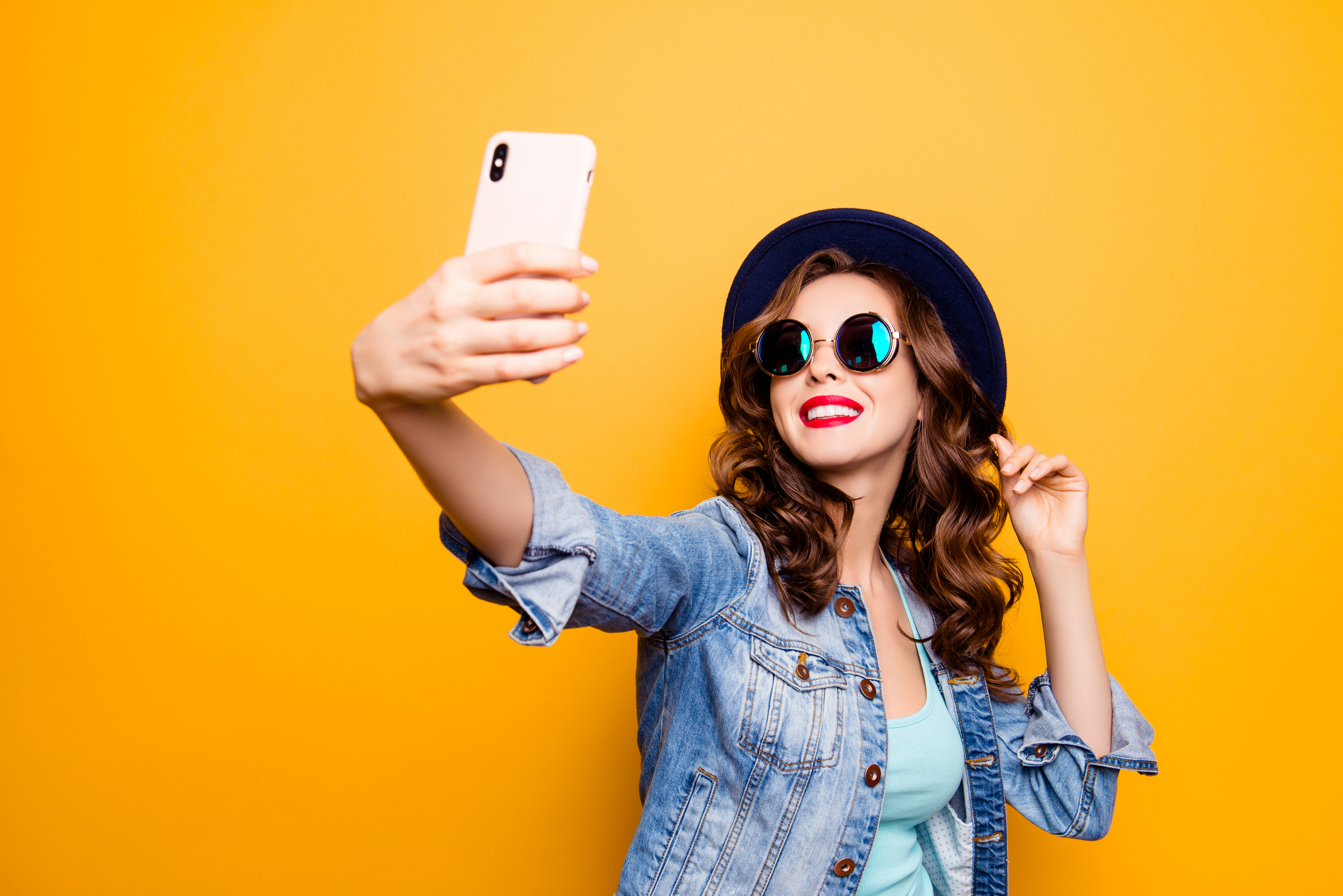 woman taking a selfie on phone