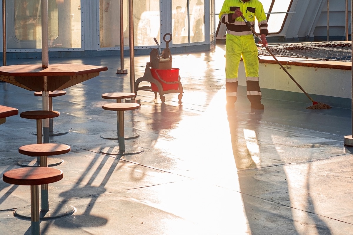 Man Cleaning Cruise Deck