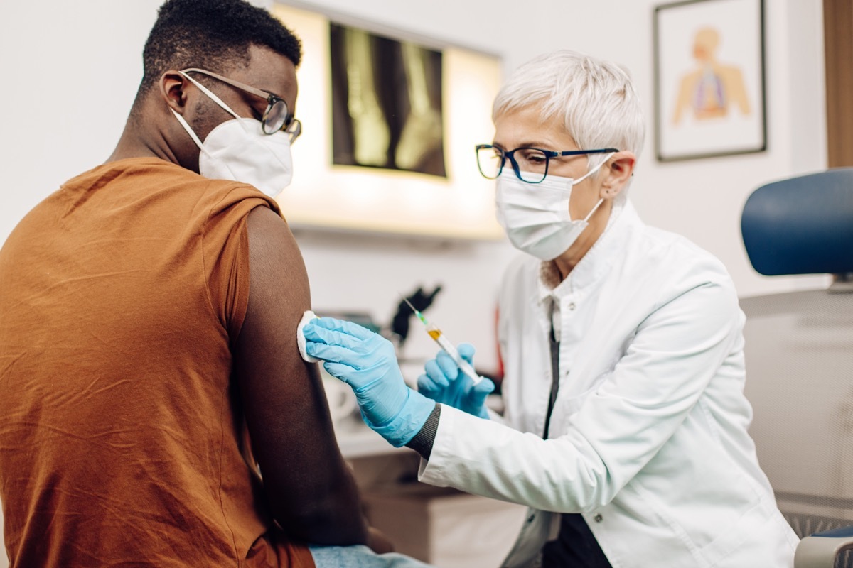 Female doctor giving a Covid-19 vaccine