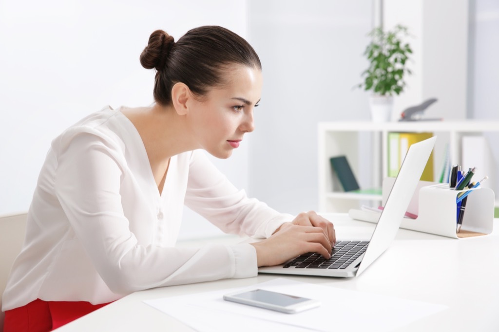 woman at desk slouching