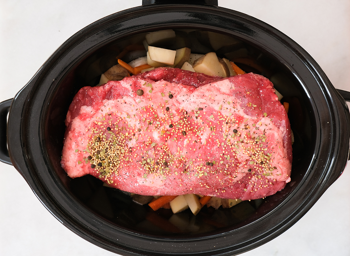 seasoned corned beef in a slow cooker