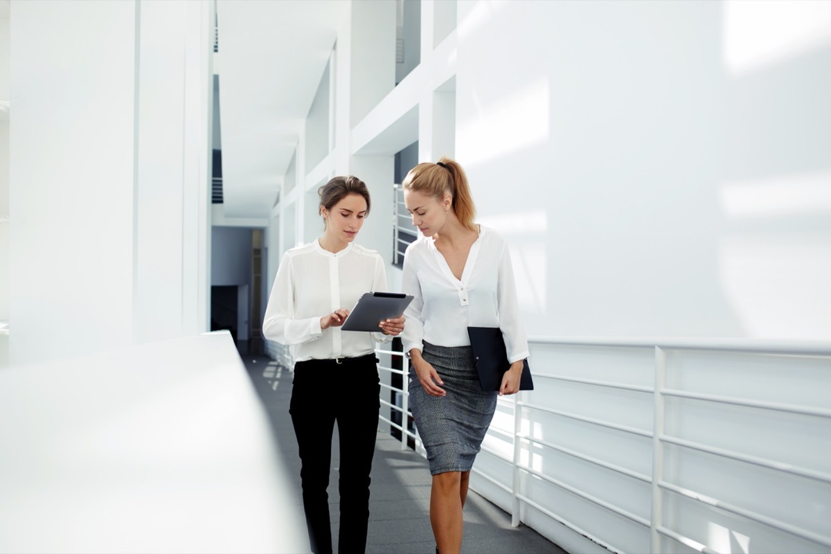 two women discussing business