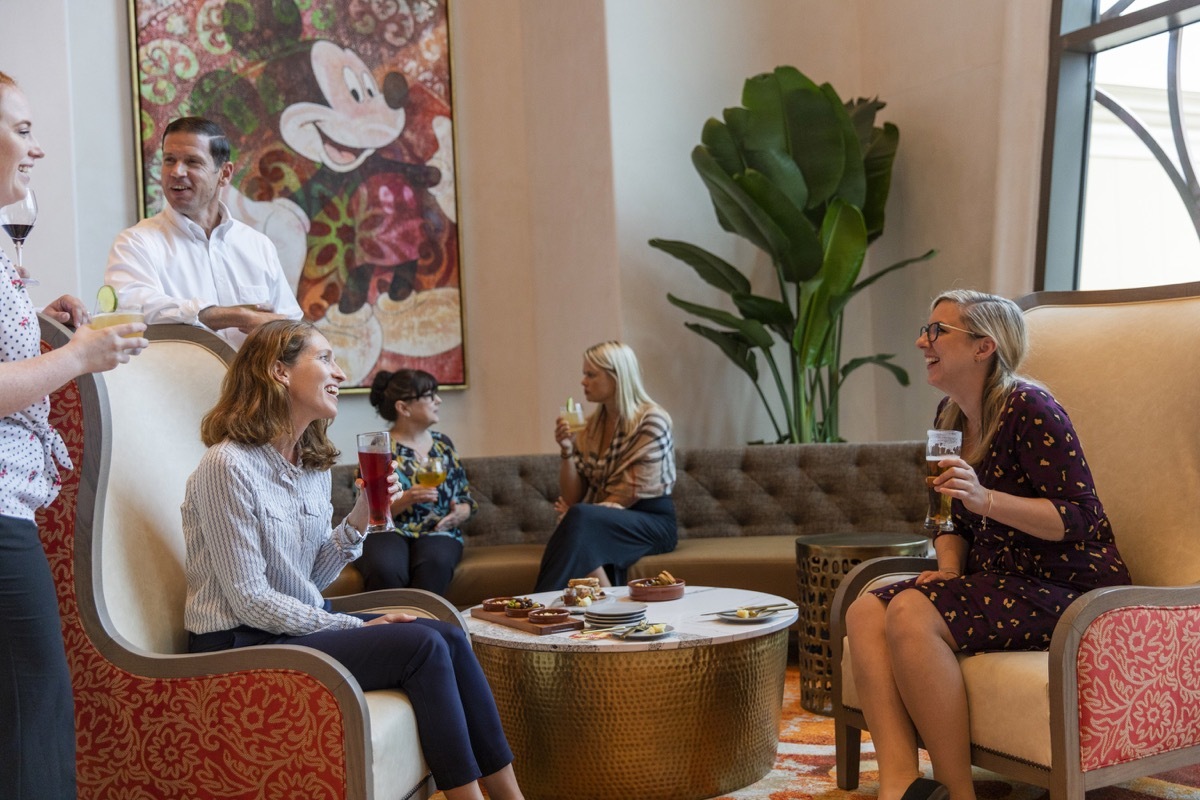 Guests at a preview of Gran Destino Tower at Disney's Coronado Springs Resort enjoy craft beers, select wines and artisanal cocktails in Barcelona Lounge. Gran Destino Tower opens July 9 at Walt Disney World Resort in Lake Buena Vista, Florida.