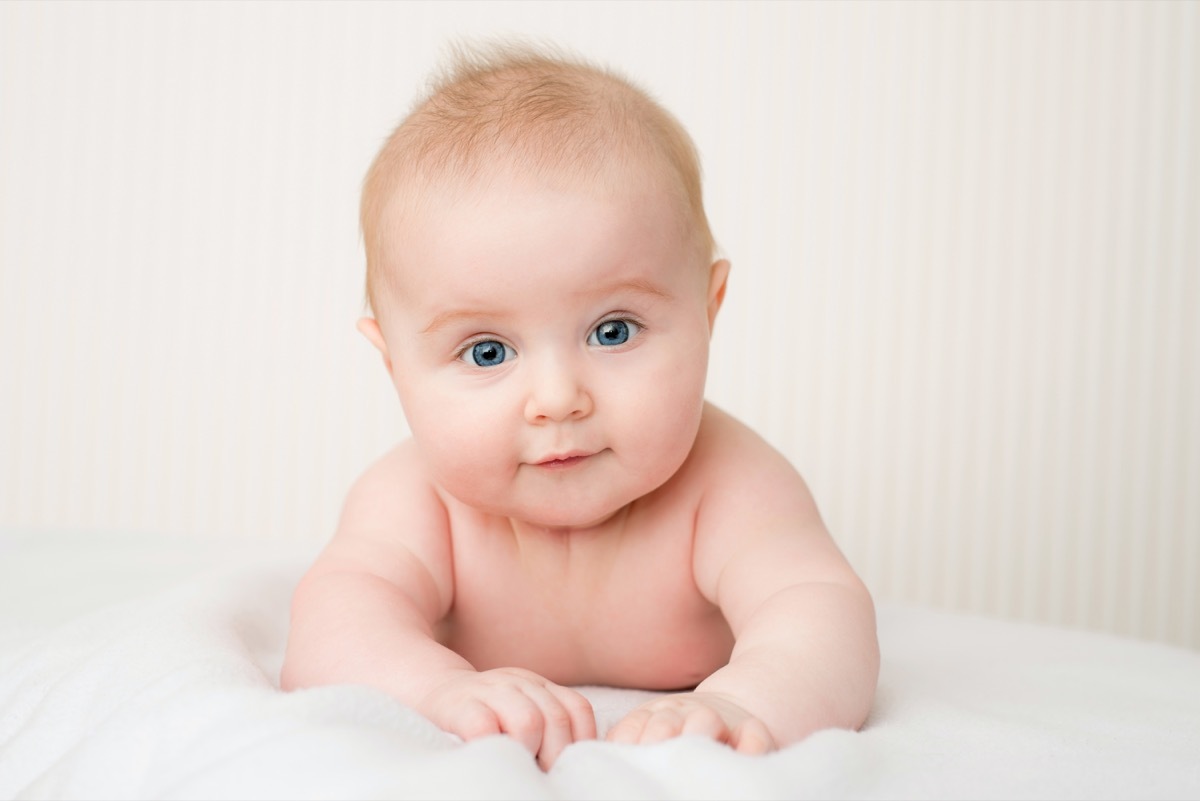 white baby on white bedding