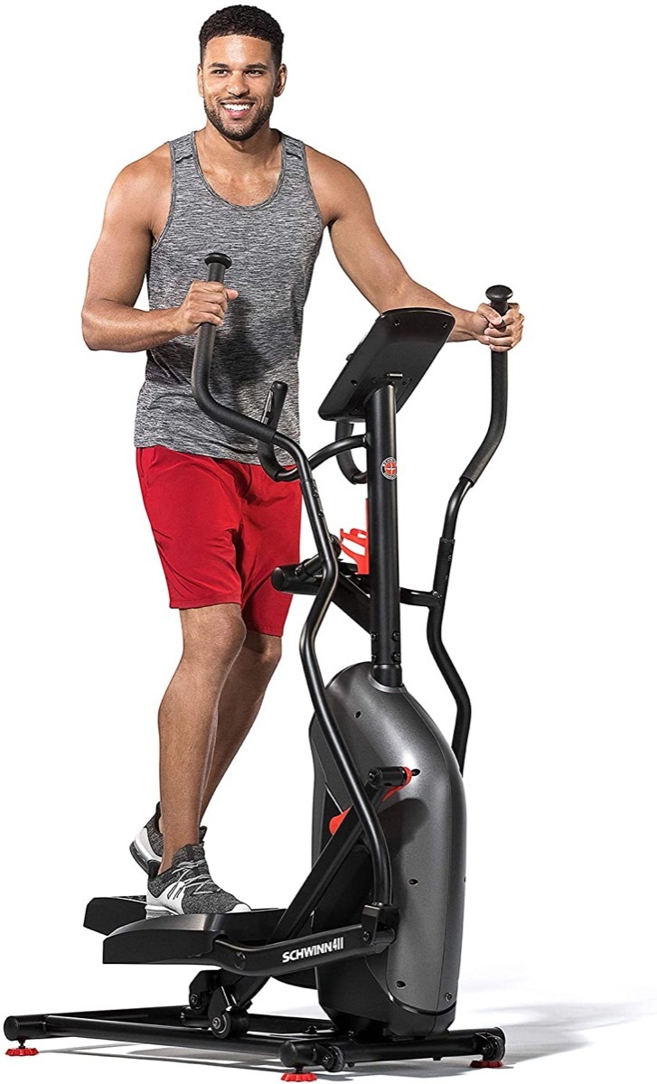 young black man on schwinn elliptical trainer