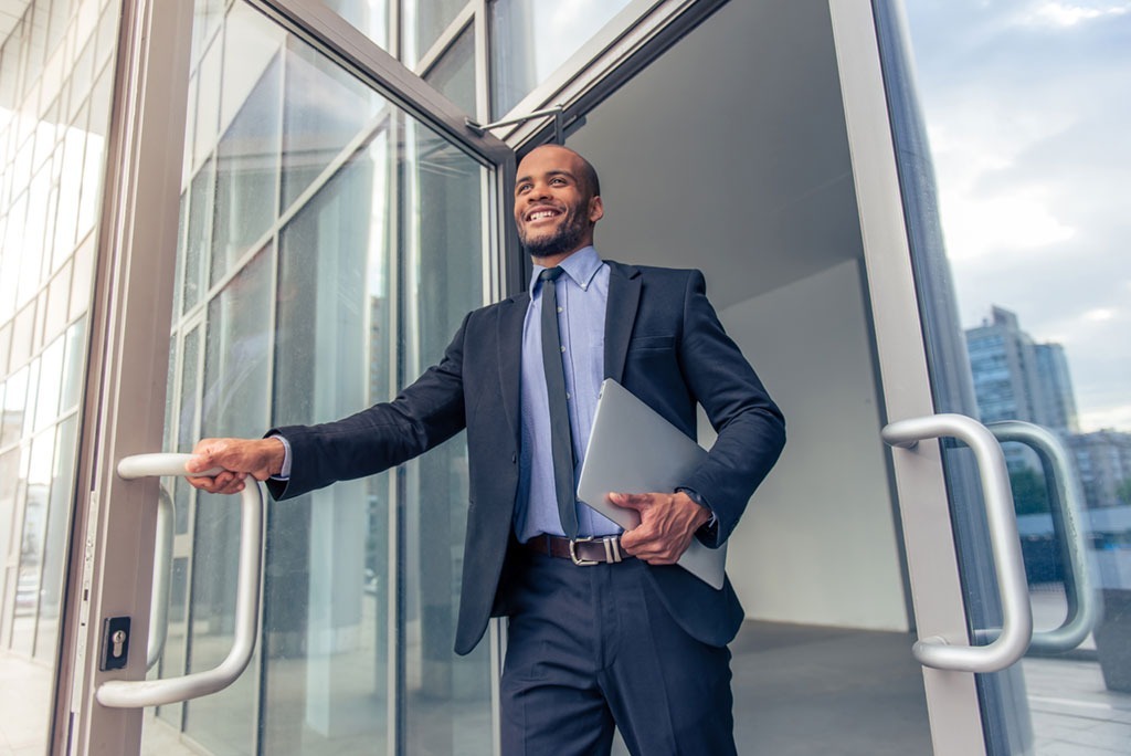 man leaving work in a suit