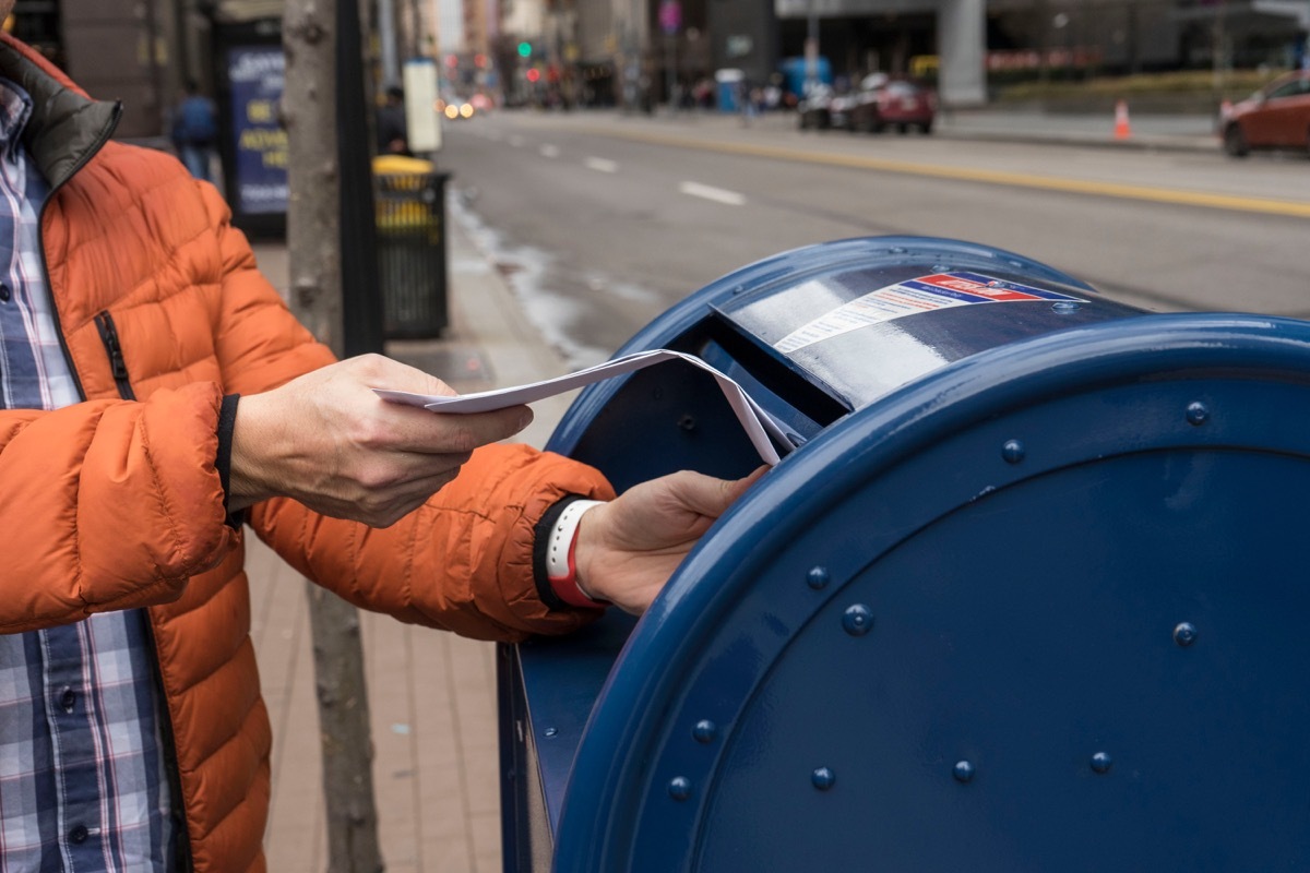 Pittsburgh, PA, USA, 2020-01-11: Man sending letter via postal service