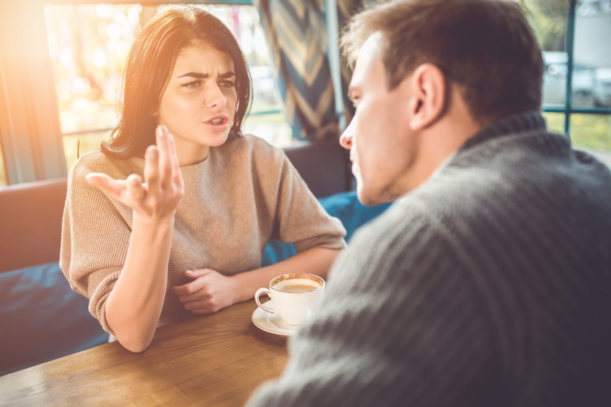 The man and woman quarreling in the cafe