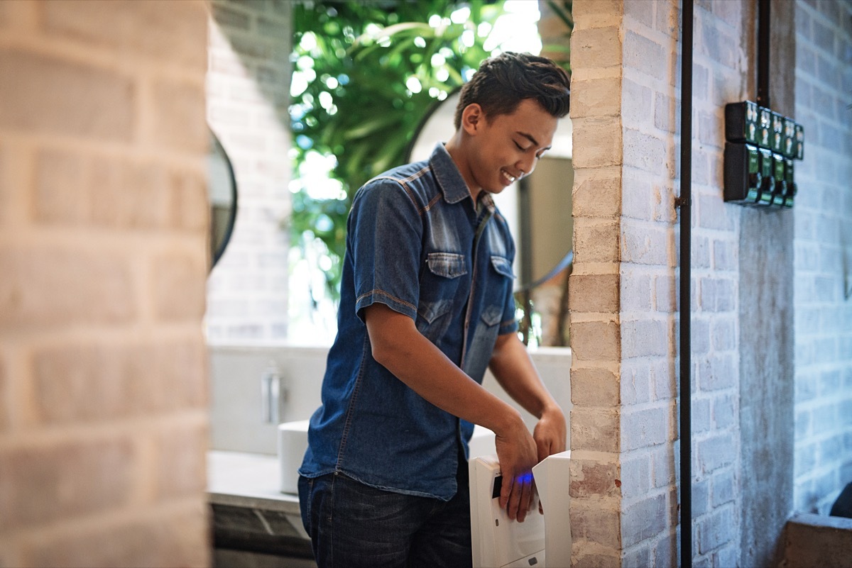 Young man in public restroom