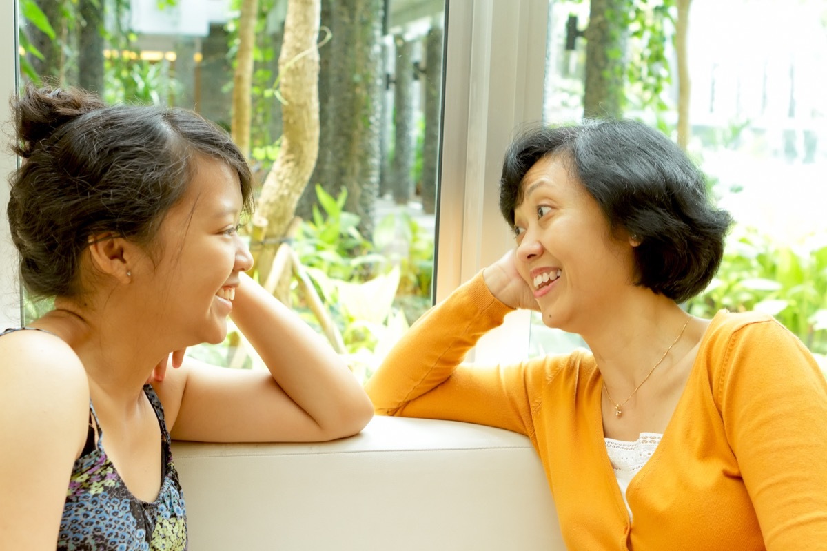 happy mother and daughter talking