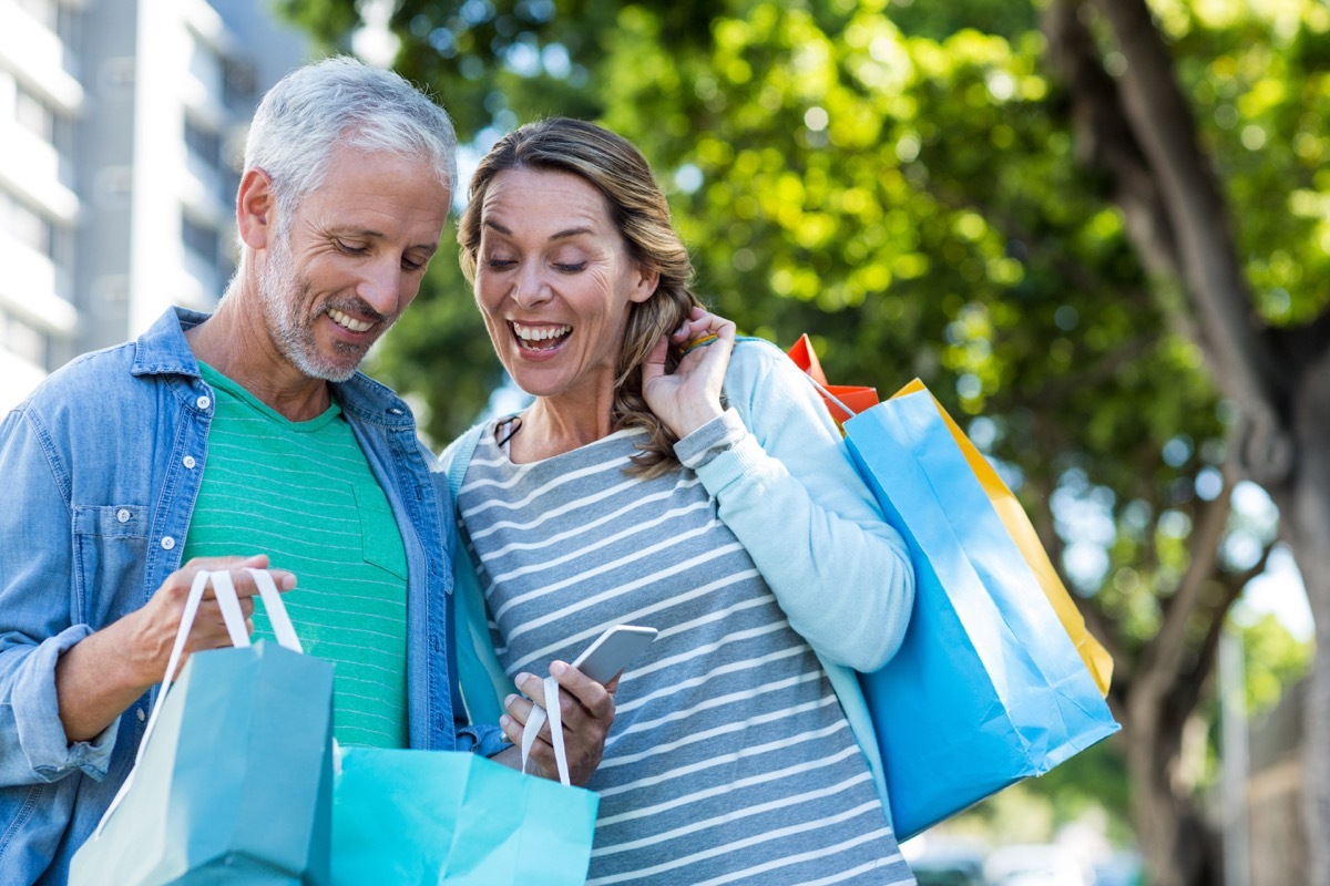 Middle age couple shopping happy