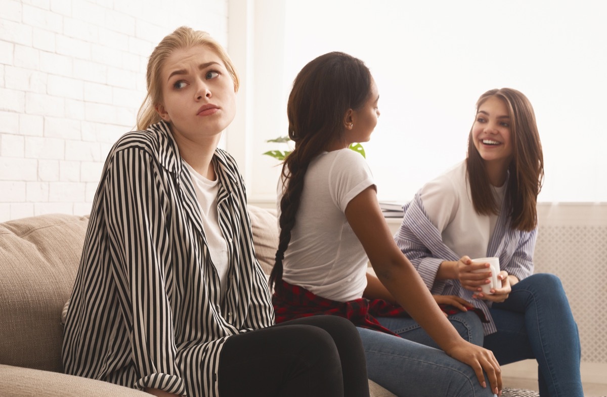 upset girl feeling lonely, avoid talking to people, suffering from discrimination