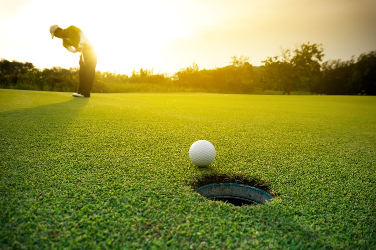 golfer making a hole in one