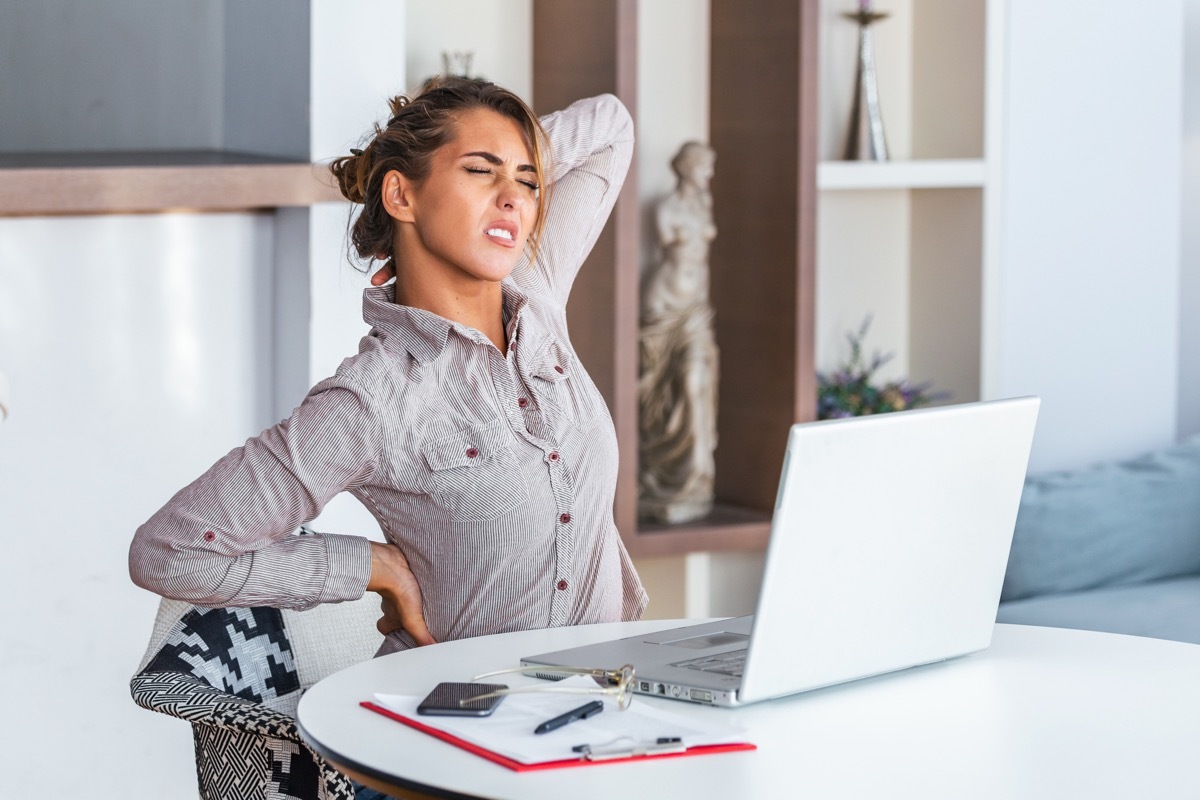 Woman with upper back pain