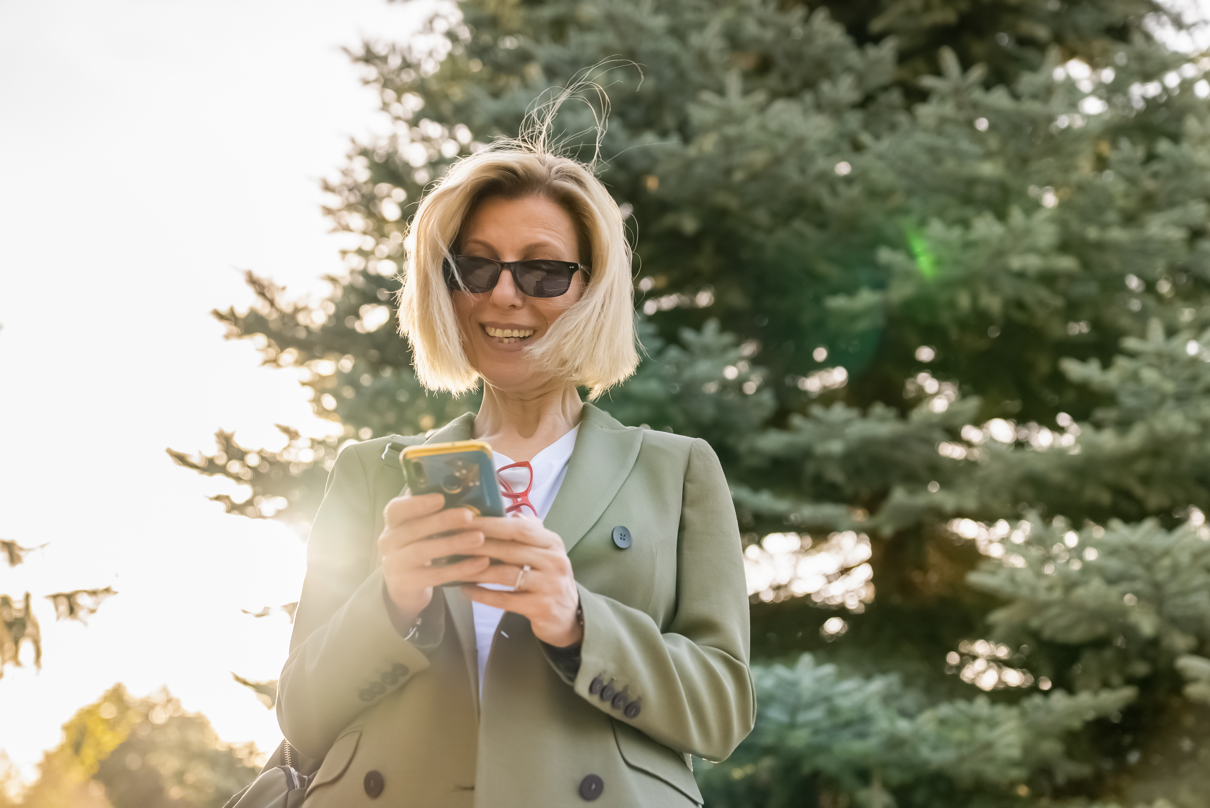 Casual Business Woman, outdoors, using mobile device