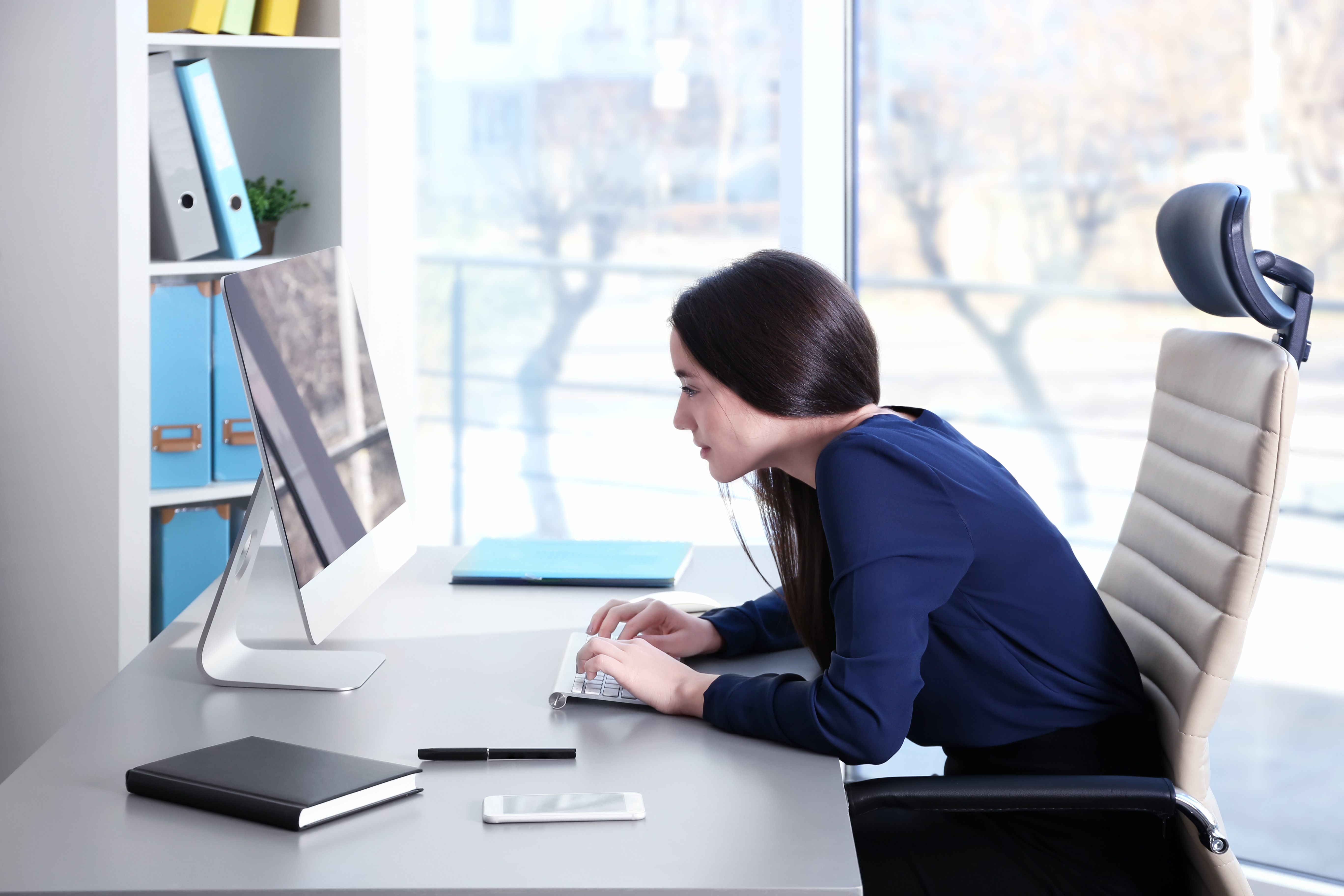 Confidence / Woman Sitting at Desk with Bad Posture