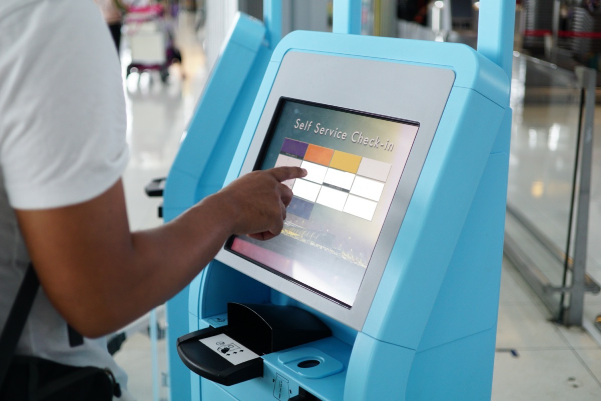 Close-up self service check in for flight or buying airplane tickets at airport