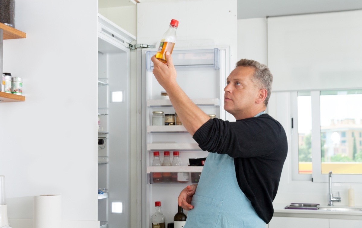 Chef opening refrigerator door