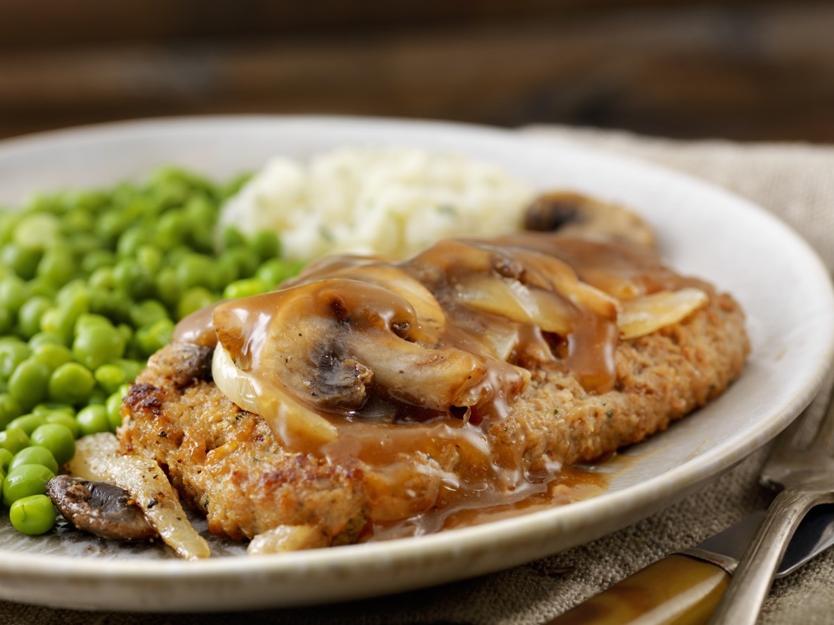 Salisbury Steak with Mushroom, Onion Gravy, Mashed Potatoes and Green Peas