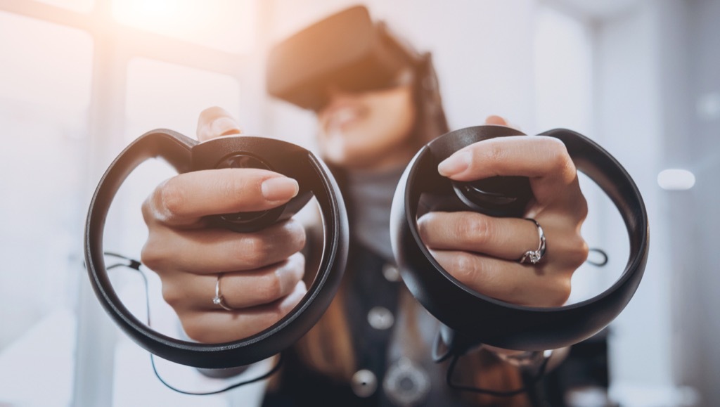 woman playing with a virtual reality headset