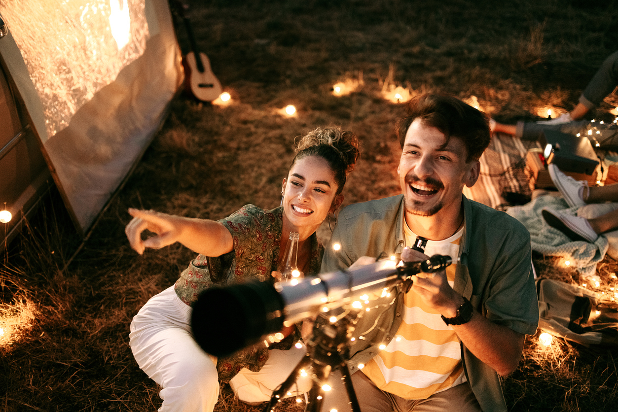 Couple stargazing together