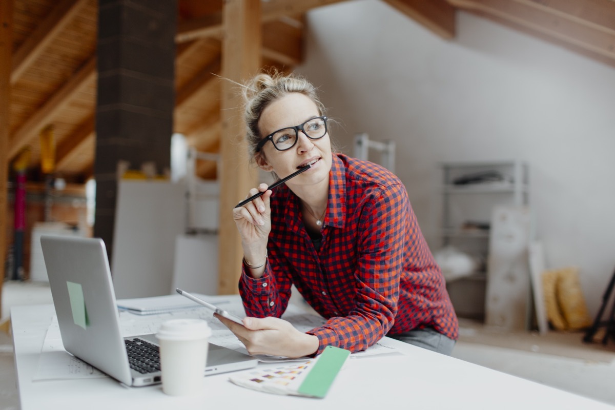 young white woman working in attic