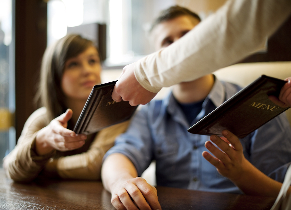 Couple on date with menus