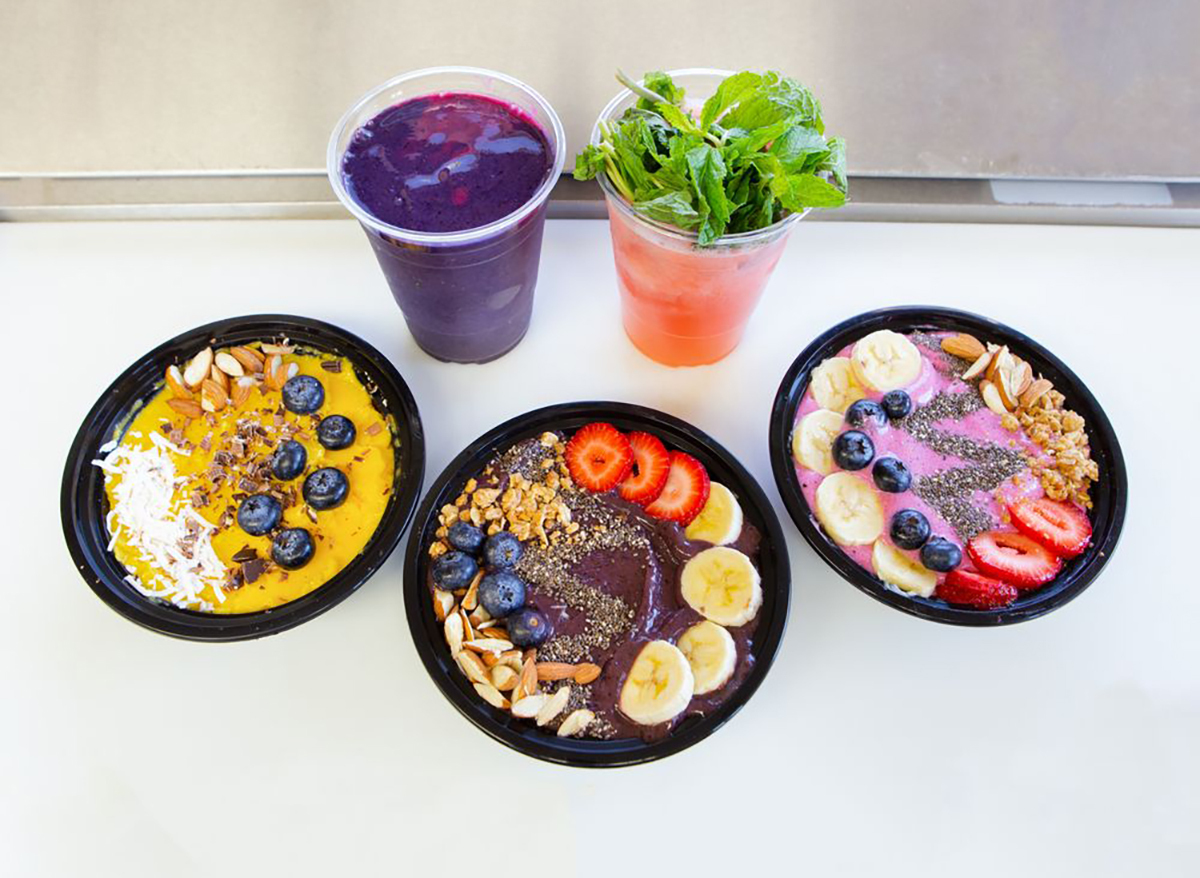 three smoothie bowls and two juices