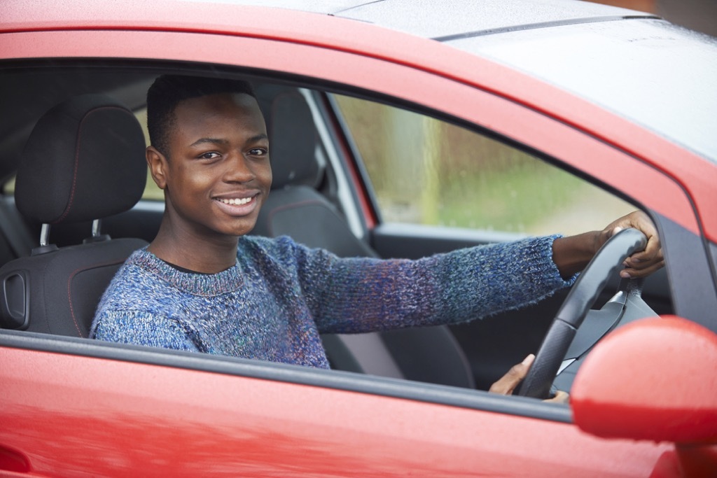 boy driving car