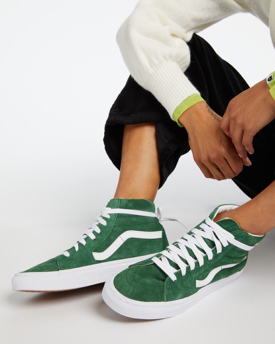 woman in green vans sneakers