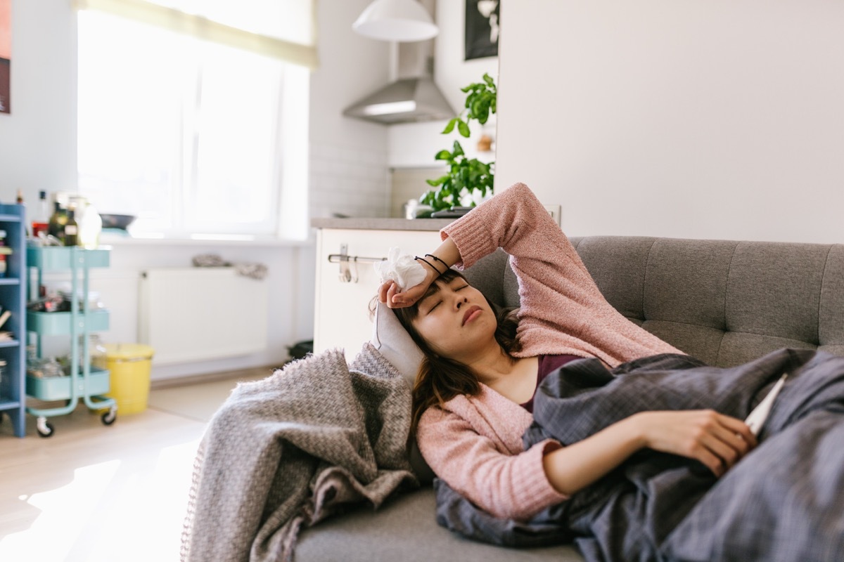 woman sick at home with high fever