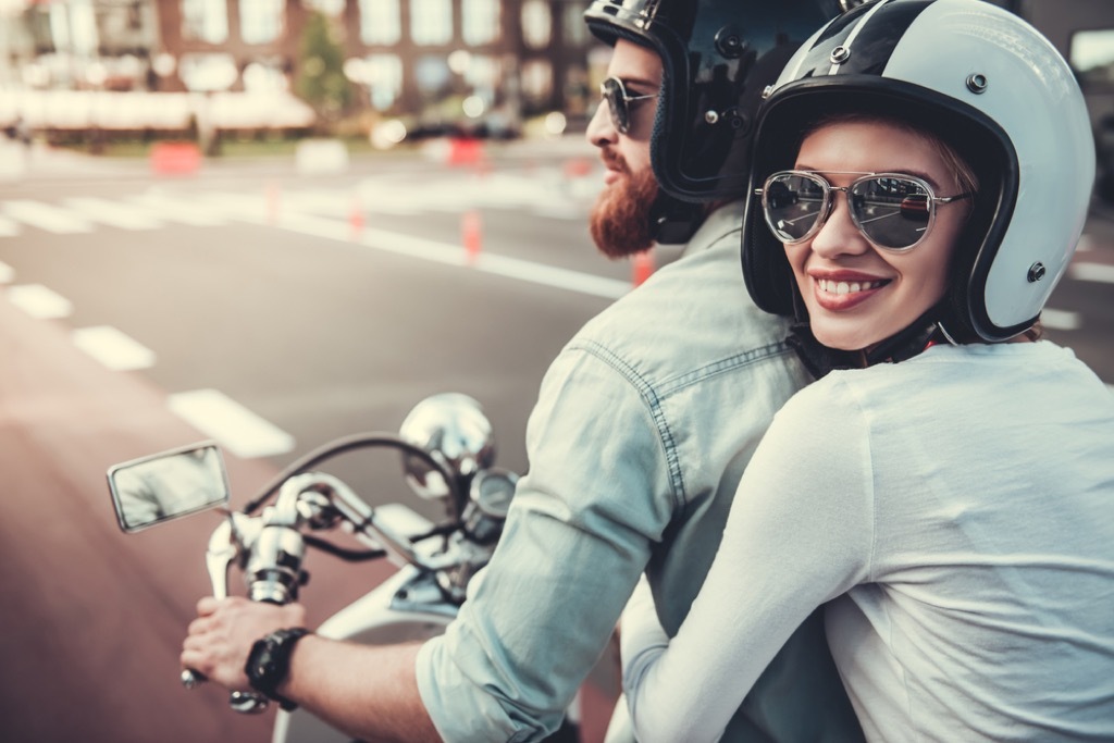 man and woman riding motorcycle fall in love