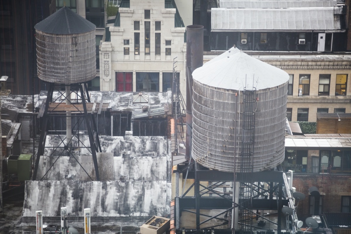 Water towers on rooftops skyline of New York City, southern view, filter effect