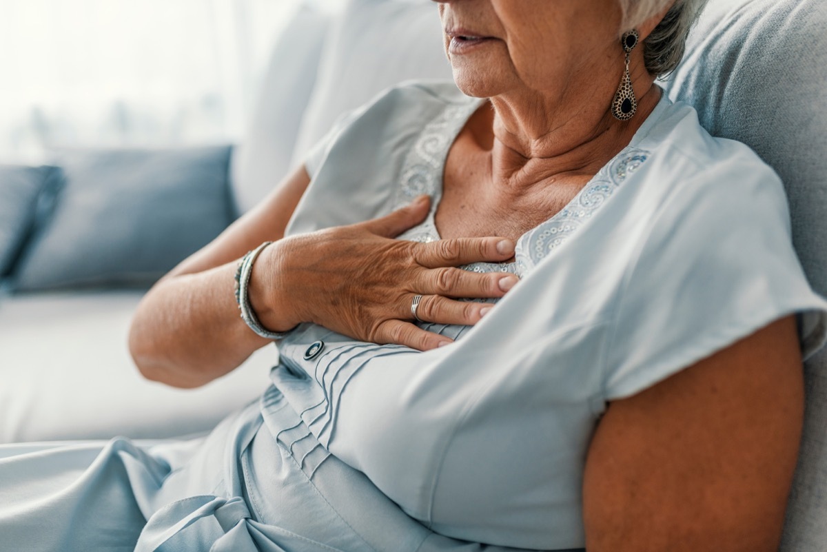 woman clutching her heart