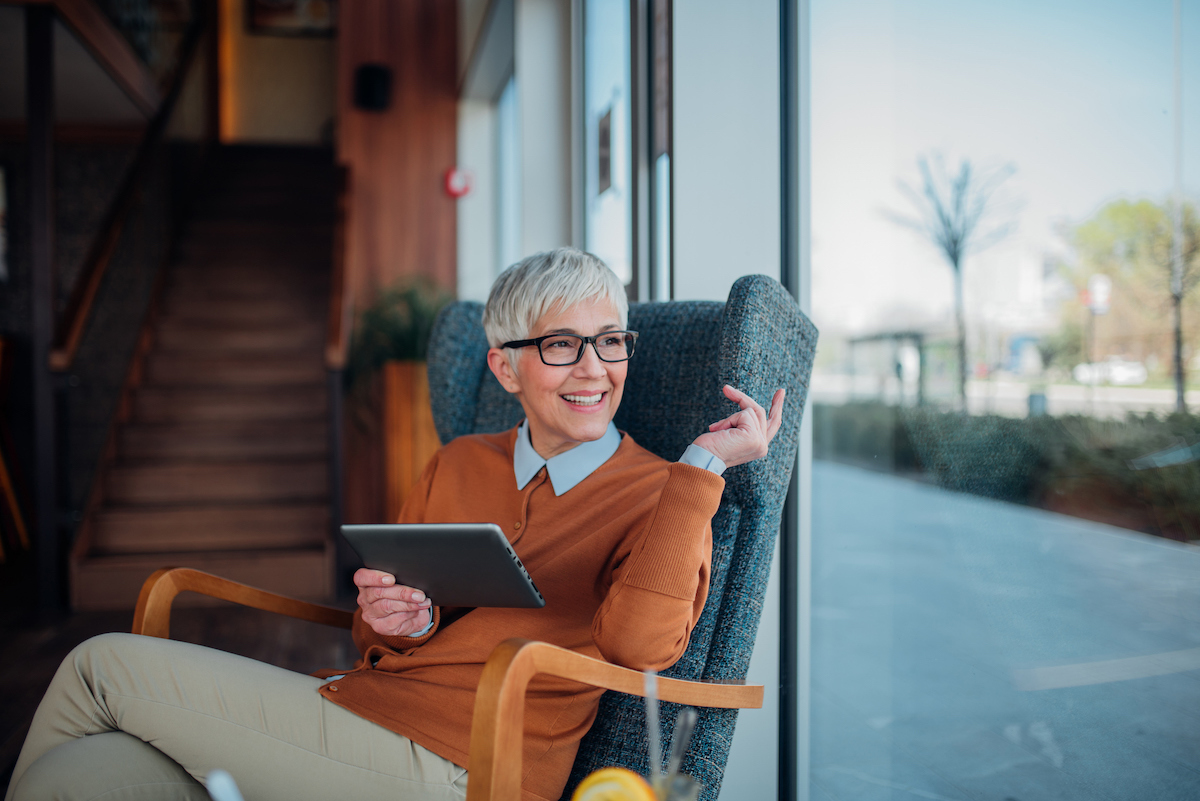 Chic older woman in brown sweater