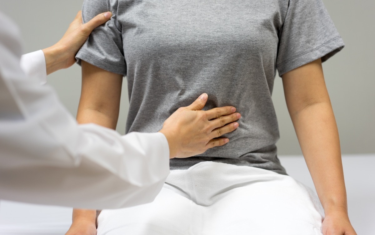 Doctor Checking Patient's Abdomen