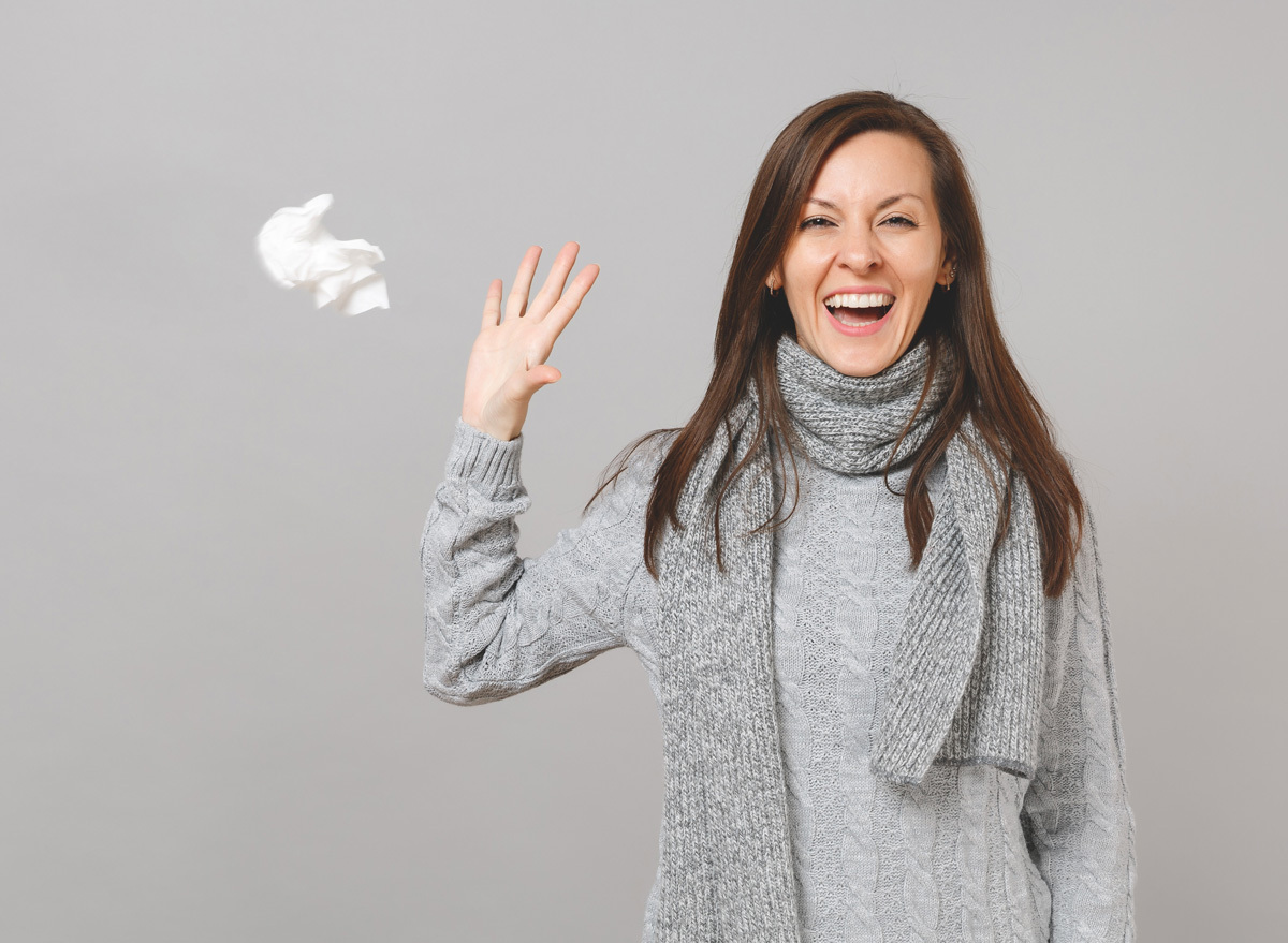 Happy woman with a strong immune system recovering from sick cold