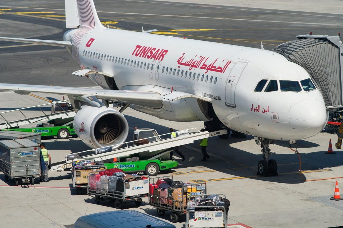 tunisair plane loading cargos