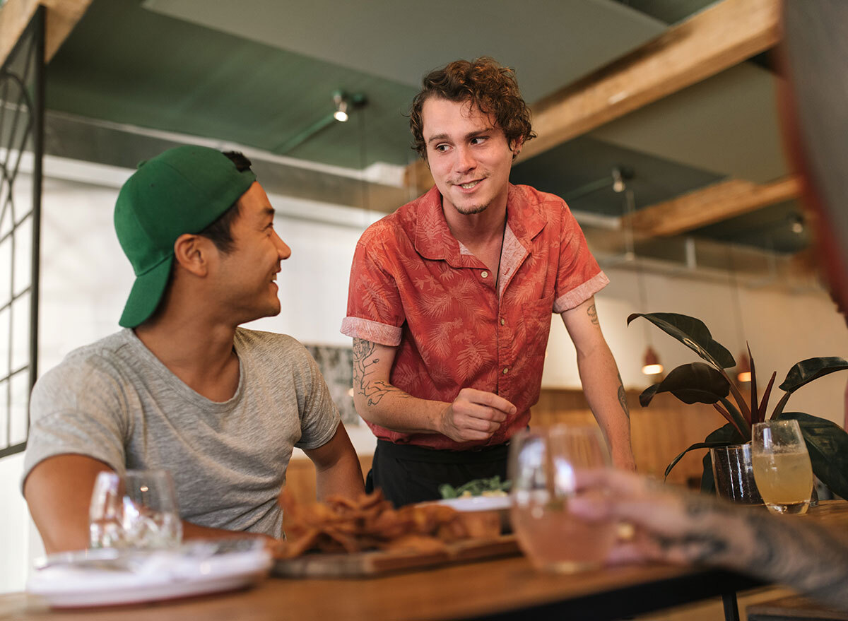 waiter checking on customer