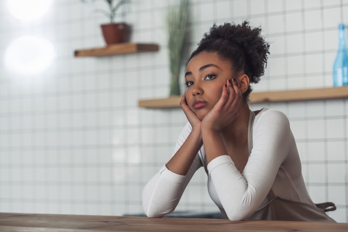 young woman looking bored